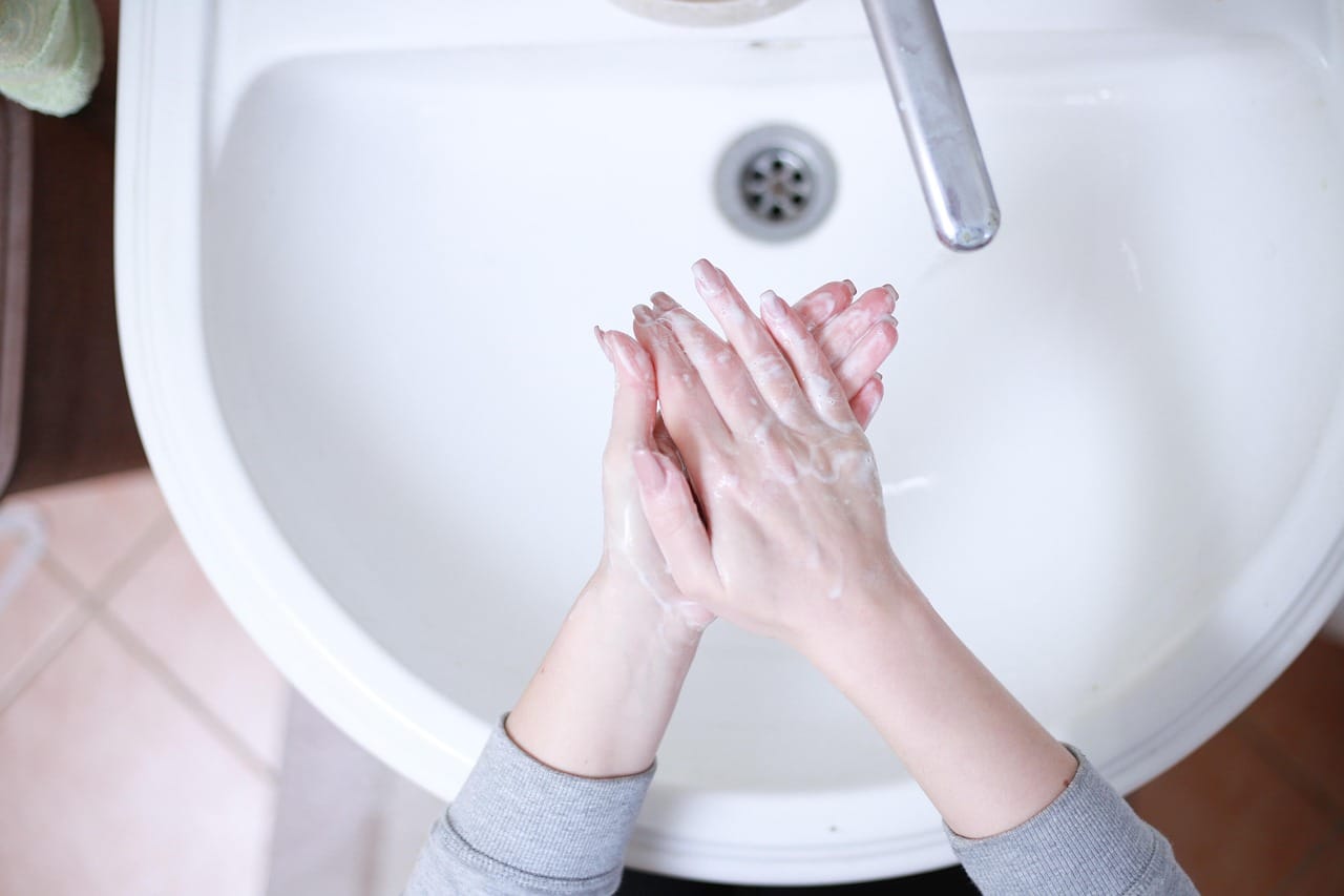 Cool water, a little soap and gentle hands. Do not rub.